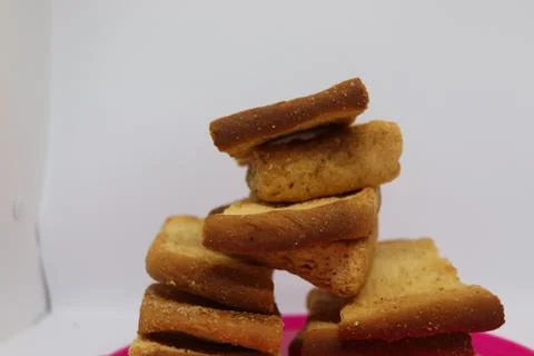 Stack of dry toast on Plastics plate. Close Up Pile of toasted bread slices.  Stock Photos