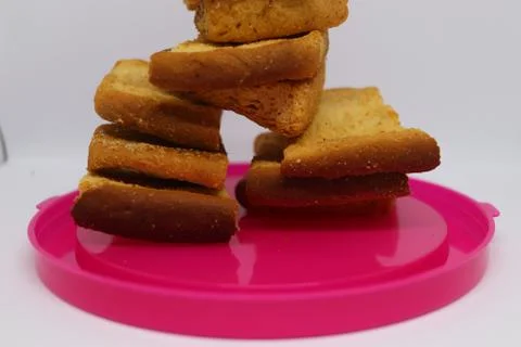 Stack of dry toast on Plastics plate. Close Up Pile of toasted bread slices.  Stock Photos