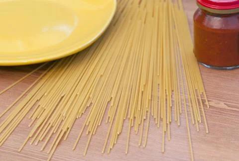 Stack of dry wholewheat spaghetti pasta. Stock Photos