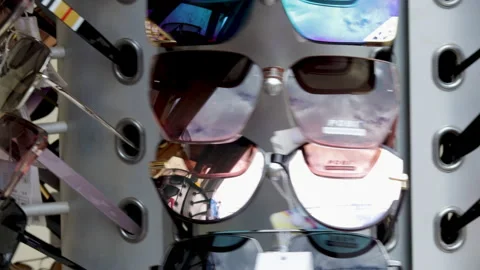 Stack of dusty,dirty glasses for sale outside on rotative stand Stock-Footage 201525591