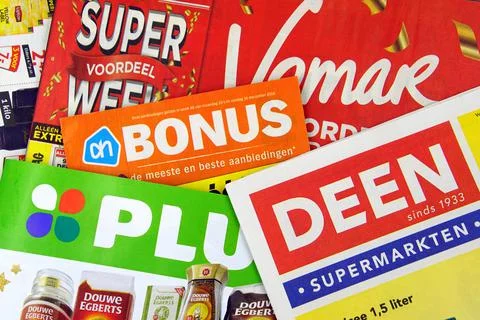 Stack of Dutch grocery shop sale flyers Stock Photos