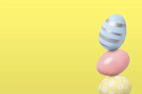 Stack of Easter eggs on light yellow background, space for text Stock Photos