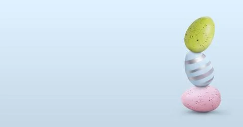 Stack of Easter eggs on pale light blue background, space for text Stock Photos