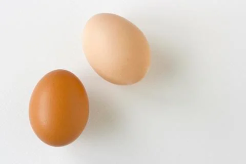Stack of  eggs on white  texture paper Stock Photos