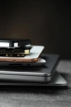 Stack of electronic devices on grey table, closeup Foto stock