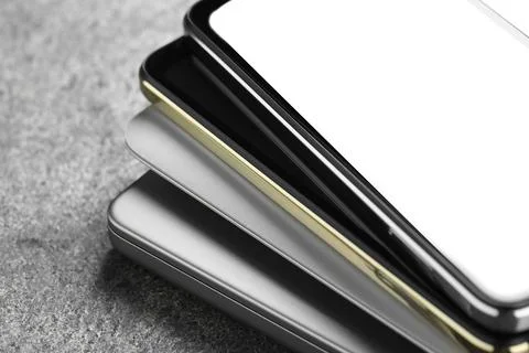 Stack of electronic devices on grey table, closeup Foto stock