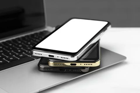 Stack of electronic devices on white table Stock Photos