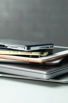 Stack of electronic devices on white table, closeup 写真素材