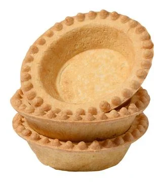 Stack of empty baked round canape baskets isolated on white background, cl... Stockfoto's