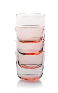Stack of empty colorful whiskey glasses on white background 写真素材