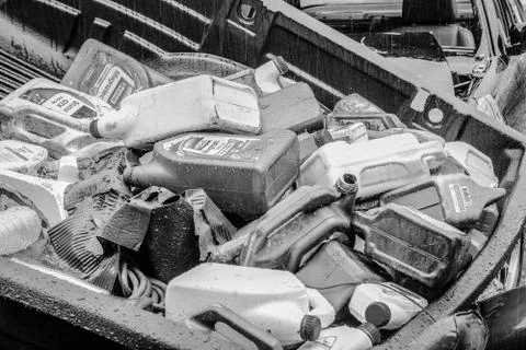 Stack of the empty oil bottles and raindrop Stock Photos