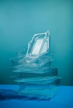 Stack of empty polystyrene plastic containters on blue Stock Photos