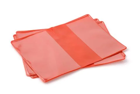Stack of empty red plastic book protective covers Stack of empty red plast... Stock Photos