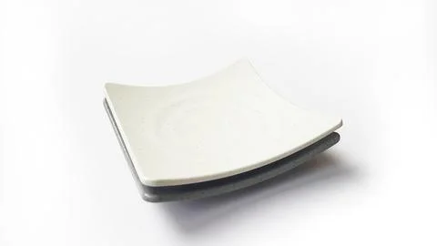 Stack of empty square white and grey plates with ceramic melamin material Stockfoto's