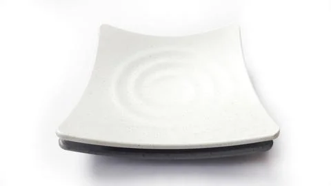 Stack of empty square white and grey plates with ceramic melamin material Stock Photos