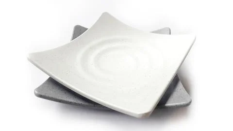 Stack of empty square white and grey plates with ceramic melamin material Stock Photos