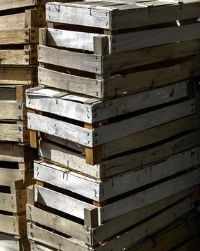 Stack of empty wooden fruit and vegetable boxes  at a food market Stock Photos