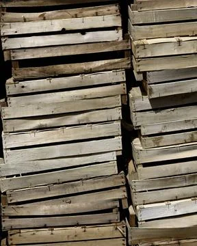 Stack of empty wooden fruit and vegetable boxes  at a food market Stock Photos