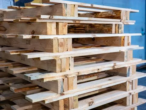 Stack of Empty Wooden Pallets in Warehouse Stock Photos