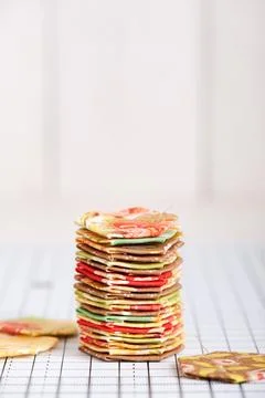 Stack english paper pieced hexagons on white craft mat Stock Photos