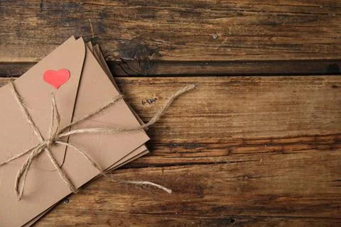 Stack of envelopes and space for text on wooden table, top view. Love letters 스톡 사진