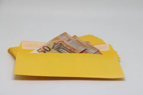 A stack of envelopes. Close-up with an envelope full of euro banknotes on a l 스톡 사진