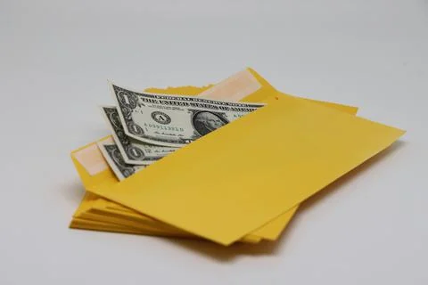 A stack of envelopes. Close-up with an envelope full of euro banknotes on a l Stockfoto's