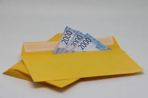 A stack of envelopes. Close-up with an envelope full of euro banknotes on a l Stock Photos