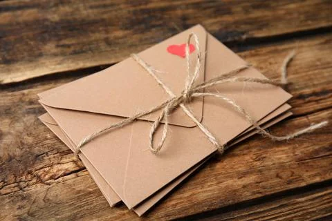 Stack of envelopes on wooden table. Love letters 写真素材