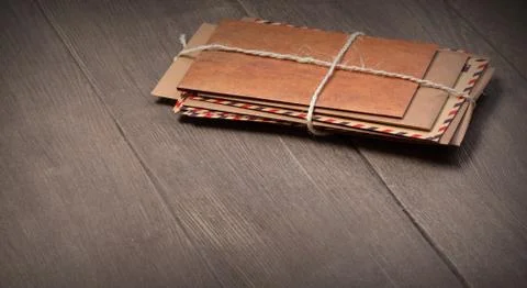 Stack of envelopes on wooden table 写真素材