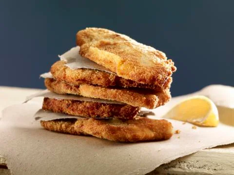 A stack of escalopes with lemon 스톡 사진