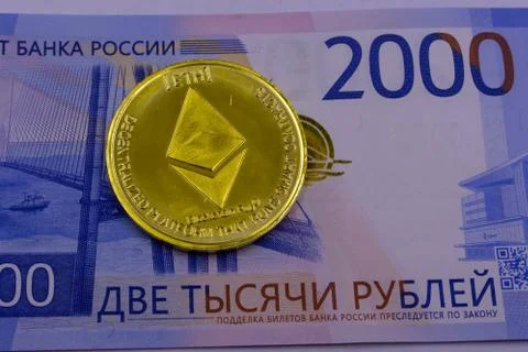 Stack of ether coins or ethereum on gold background to illustrate blockchain  Stock Photos