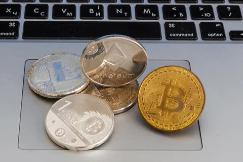 Stack of ethereum coins with gold background Stock Photos