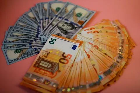 A stack of euro and dollar banknotes Stock Photos