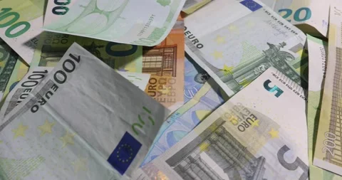 Stack of euro banknotes isolated on a black table.. Financial crisis. Stock Footage 141273536