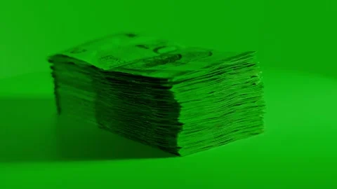 Stack of Euro Bills in Green Light Suggests Hidden Financial Operations Stock Footage 323045342