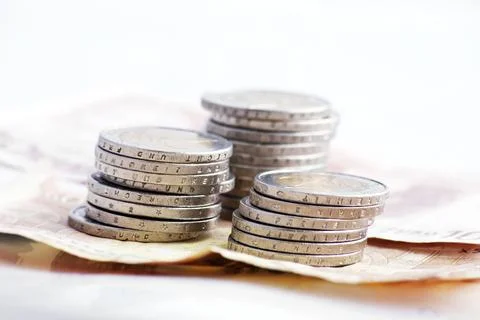 Stack of Euro coins on banknotes Stock Photos