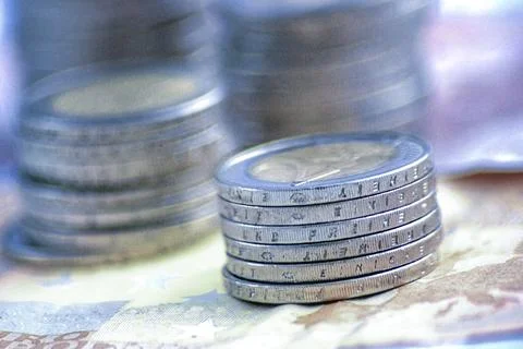 Stack of Euro coins on banknotes Stock Photos