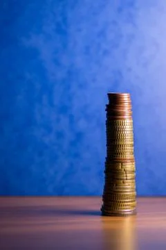 Stack of euro coins in a blue background Stock Photos