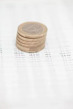 Stack Of Euro Coins On Financial Data Foto stock