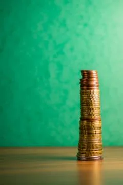 Stack of euro coins in a green background Stock Photos