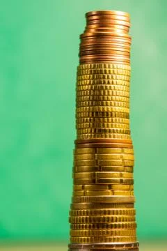 Stack of euro coins in a green background Stock Photos