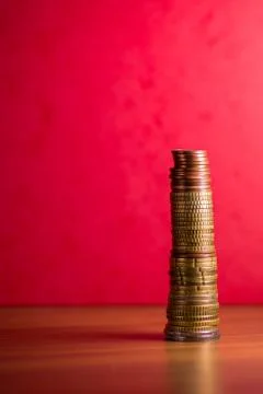 Stack of euro coins in a red background Stock Photos