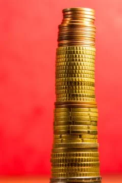 Stack of euro coins in a red background Stock Photos