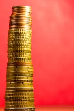 Stack of euro coins in a red background Stock Photos