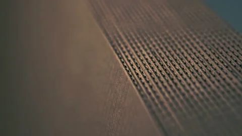 A stack of evenly folded brown cardboard. Close-up. Stock Footage 142623456