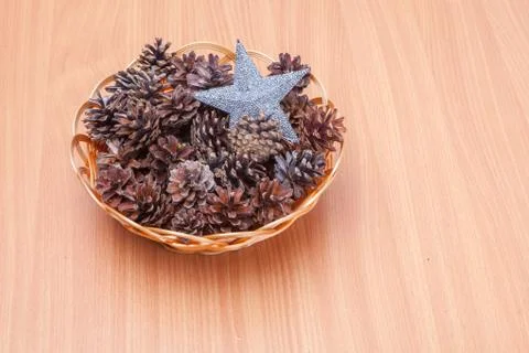 Stack of evergreen pinecones and silver start Stock Photos