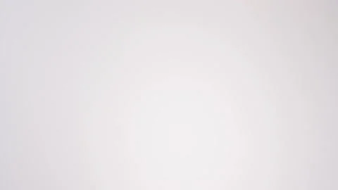 Stack of everything bagels raining on white slow motion macro food studio 4K Stock Footage 337909730