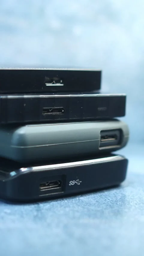 Stack of external hard drives on table  Stock Footage 297941251