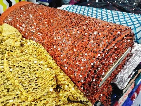 Stack of Fabric Rolls in market Stock-Fotos